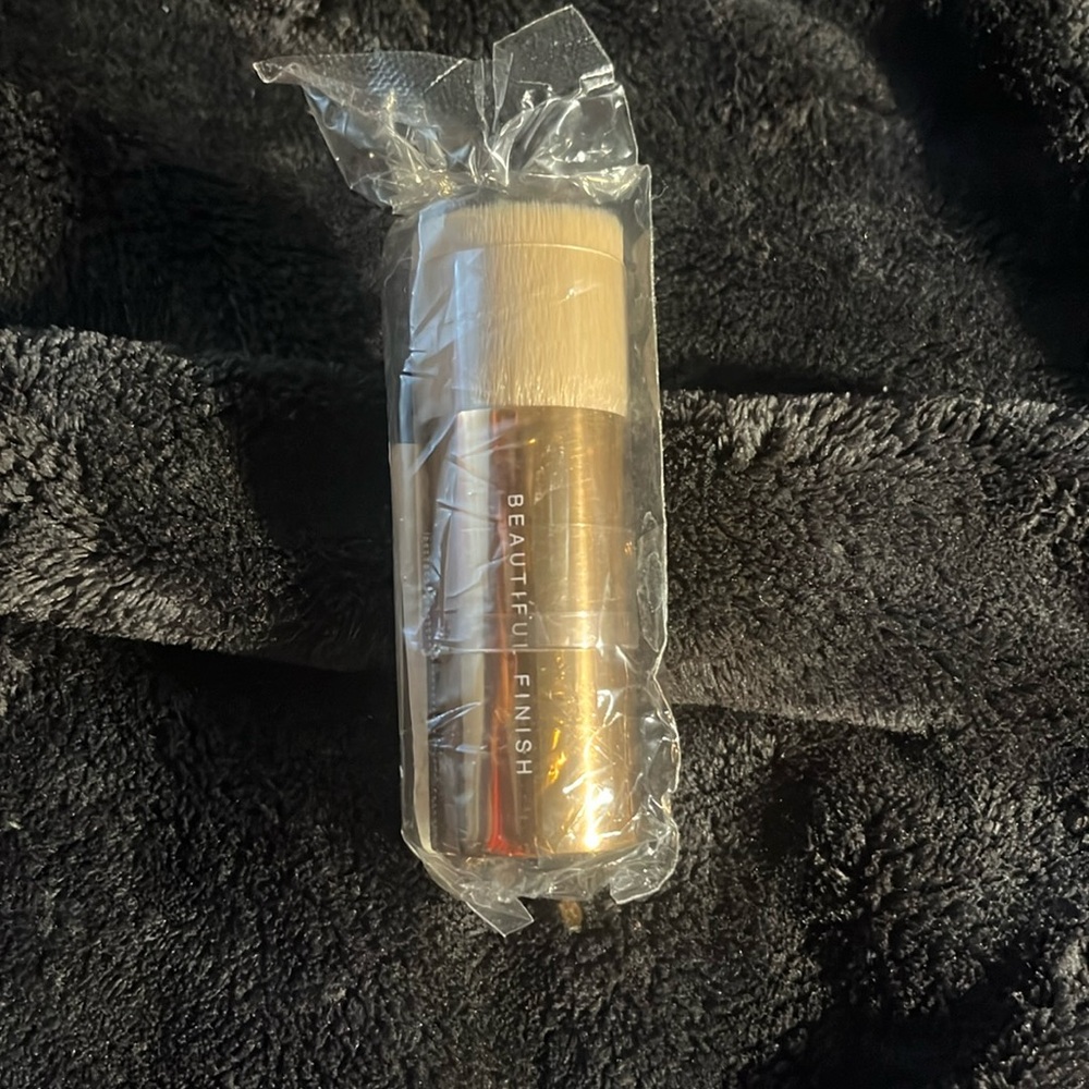 Brand new and unused bareMinerals beautiful finish brush with gold handle.